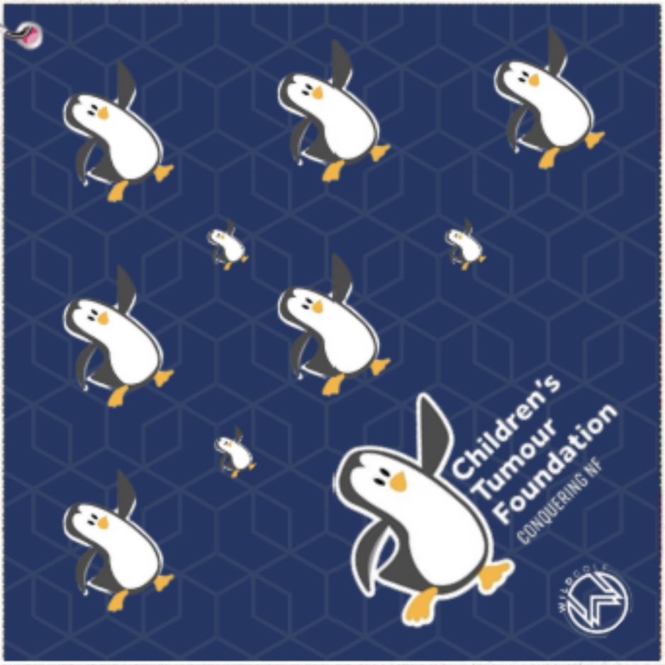 charity golf towel with Pattern of penguins on a blue background with 'Children's Tumour Foundation' text.