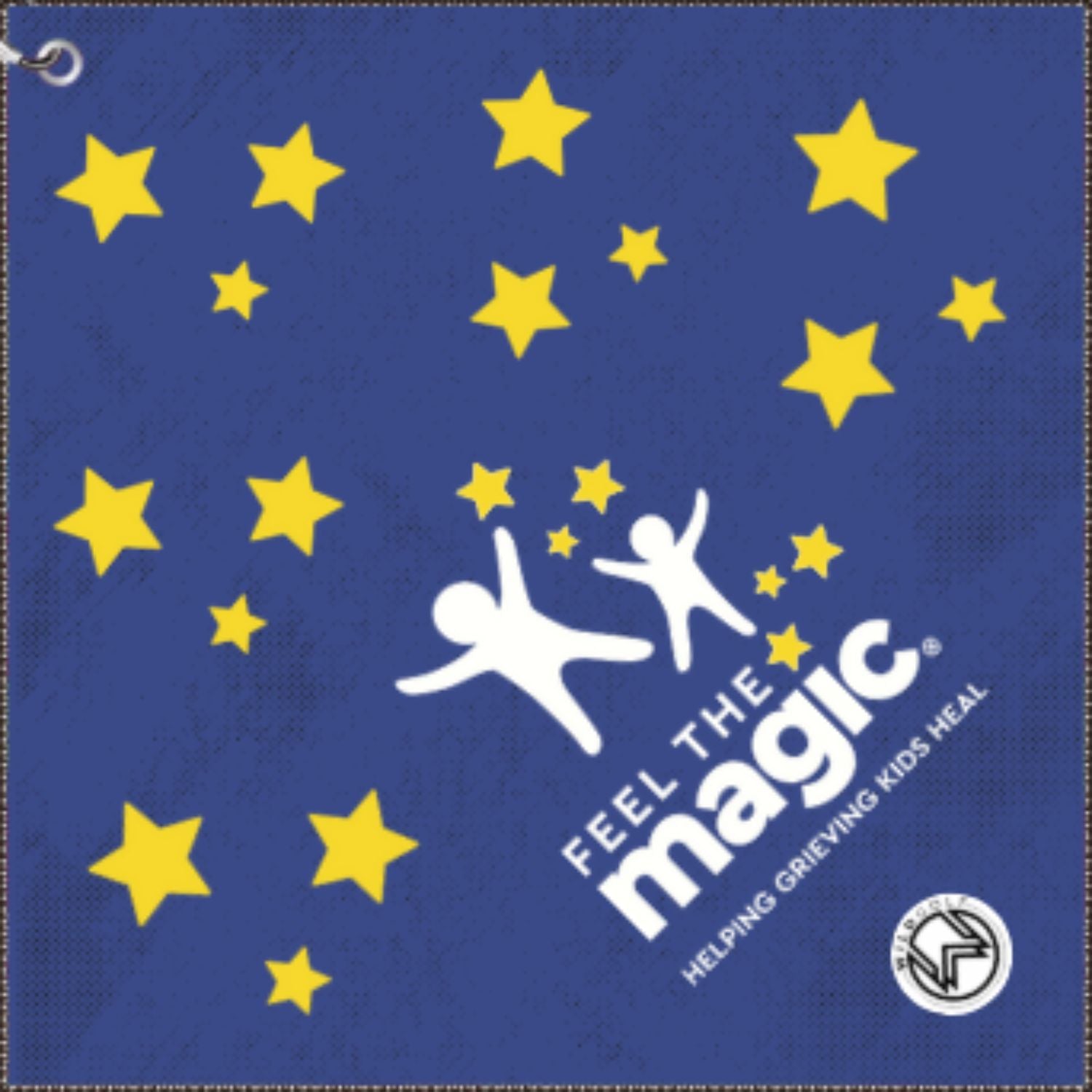 charity golf towel,  Blue banner with yellow stars and 'Feel the Magic' logo